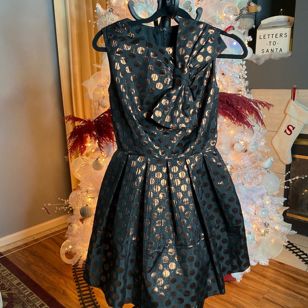 Metallic polka dot mini dress with bow. Great for holiday parties!